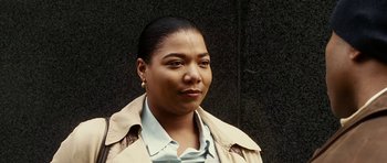 Movie still from “Last Holiday” (2006), directed by Wayne Wang – A person wearing a jacket; Close Up shot, High angle