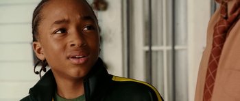 Movie still from “Last Holiday” (2006), directed by Wayne Wang – A person wearing a green and yellow jacket; Close Up shot, Over the shoulder angle
