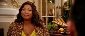 Movie still from “Last Holiday” (2006), directed by Wayne Wang – A person wearing a yellow shirt; Close Up shot, Over the shoulder angle