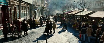Movie still from “Last Holiday” (2006), directed by Wayne Wang – A crowd of people walking down a street; Extreme Wide shot, High angle