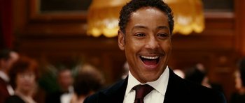 Movie still from “Last Holiday” (2006), directed by Wayne Wang – A person wearing a suit and tie; Close Up shot, Low angle