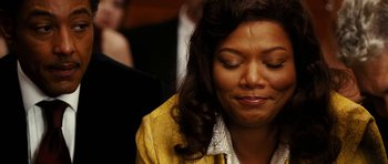 Movie still from “Last Holiday” (2006), directed by Wayne Wang – A person with her eyes closed; Close Up shot, Over the shoulder angle