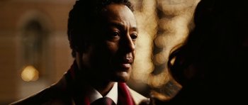 Movie still from “Last Holiday” (2006), directed by Wayne Wang – A person holding a microphone; Close Up shot, Over the shoulder angle