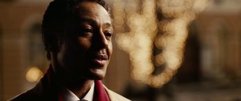 Movie still from “Last Holiday” (2006), directed by Wayne Wang – A person wearing a suit and tie; Close Up shot, Over the shoulder angle
