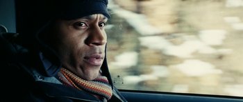 Movie still from “Last Holiday” (2006), directed by Wayne Wang – A person in a car looking out the window; Close Up shot, Low angle