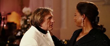 Movie still from “Last Holiday” (2006), directed by Wayne Wang – A man and a woman looking at one another; Close Up shot, Over the shoulder angle