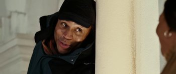 Movie still from “Last Holiday” (2006), directed by Wayne Wang – A person leaning against a wall; Close Up shot, Low angle