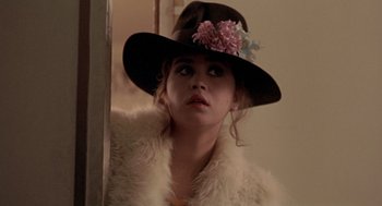 Movie still from “Last Tango in Paris” (1972), directed by Bernardo Bertolucci – A woman wearing a hat and a fur coat; Close Up shot, Over the shoulder angle