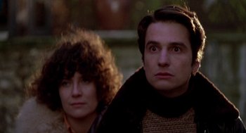 Movie still from “Last Tango in Paris” (1972), directed by Bernardo Bertolucci – A man and a woman are standing next to each other; Close Up shot, Low angle