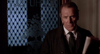 Movie still from “Last Tango in Paris” (1972), directed by Bernardo Bertolucci – A man in a suit and a tie; Close Up shot, Low angle