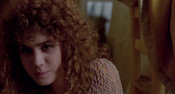 Movie still from “Last Tango in Paris” (1972), directed by Bernardo Bertolucci – A person with curly red hair; Close Up shot, Over the shoulder angle