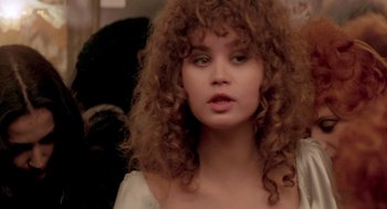 Movie still from “Last Tango in Paris” (1972), directed by Bernardo Bertolucci – A person with curly brown hair; Close Up shot, Over the shoulder angle