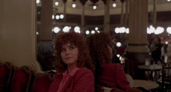 Movie still from “Last Tango in Paris” (1972), directed by Bernardo Bertolucci – A woman in a red plaid jacket and a woman in a red plaid jacket; Medium shot, Over the shoulder angle