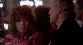 Movie still from “Last Tango in Paris” (1972), directed by Bernardo Bertolucci – A woman sitting next to a man on a train; Close Up shot, Over the shoulder angle