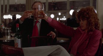 Movie still from “Last Tango in Paris” (1972), directed by Bernardo Bertolucci – A man and a woman holding glasses of beer; Medium shot, Low angle