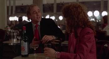 Movie still from “Last Tango in Paris” (1972), directed by Bernardo Bertolucci – A man and a woman sitting at a table with wine glasses; Medium shot, Over the shoulder angle