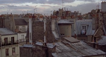 Movie still from “Last Tango in Paris” (1972), directed by Bernardo Bertolucci – A view of a city rooftops from a distance; Extreme Wide shot, High angle