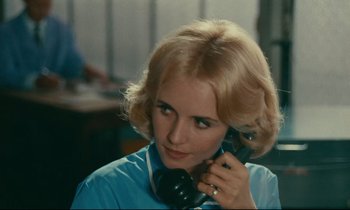 Movie still from “Happiness” (1965), directed by Agnès Varda – A woman talking on a phone while sitting down; Close Up shot, Over the shoulder angle