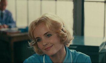 Movie still from “Happiness” (1965), directed by Agnès Varda – A person with blonde hair; Close Up shot, Over the shoulder angle
