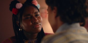 Movie still from “Everything Now” (2023), created by Ripley Parker – A young woman is crying as she talks to a young man; Close Up shot, Over the shoulder angle