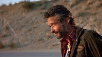 Movie still from “Leatherface: Texas Chainsaw Massacre III” (1990), directed by Jeff Burr – A person with a beard; Close Up shot, Low angle