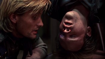 Movie still from “Leatherface: Texas Chainsaw Massacre III” (1990), directed by Jeff Burr – A man and a woman looking at each other's face; Close Up shot, Overhead angle