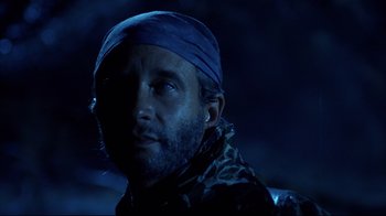 Movie still from “Leatherface: Texas Chainsaw Massacre III” (1990), directed by Jeff Burr – A person wearing a hat; Close Up shot, Low angle