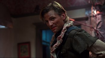 Movie still from “Leatherface: Texas Chainsaw Massacre III” (1990), directed by Jeff Burr – A person with long blonde hair; Close Up shot, Low angle