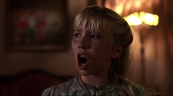 Movie still from “Leatherface: Texas Chainsaw Massacre III” (1990), directed by Jeff Burr – A young blonde girl with her mouth wide open; Close Up shot, Low angle