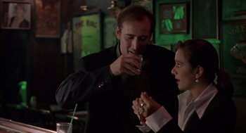 Movie still from “Leaving Las Vegas” (1995), directed by Mike Figgis – A man and a woman are having a drink together; Close Up shot, Over the shoulder angle