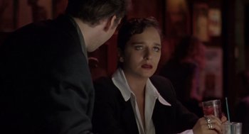 Movie still from “Leaving Las Vegas” (1995), directed by Mike Figgis – A man and a woman sitting at a dinner table; Close Up shot, Over the shoulder angle
