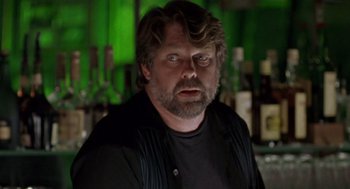 Movie still from “Leaving Las Vegas” (1995), directed by Mike Figgis – A person in a room; Close Up shot, Over the shoulder angle