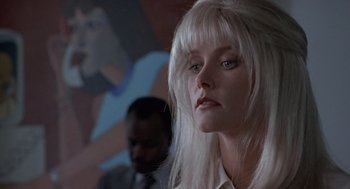 Movie still from “Leaving Las Vegas” (1995), directed by Mike Figgis – A woman with long white hair is looking at the camera; Close Up shot, Low angle