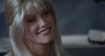 Movie still from “Leaving Las Vegas” (1995), directed by Mike Figgis – A person with a smile on their face; Close Up shot, Over the shoulder angle