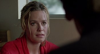 Movie still from “Leaving Las Vegas” (1995), directed by Mike Figgis – A person sitting in front of a window; Close Up shot, Over the shoulder angle