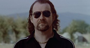 Movie still from “Leaving Las Vegas” (1995), directed by Mike Figgis – A person wearing sunglasses; Close Up shot, Low angle