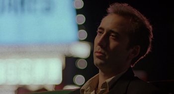 Movie still from “Leaving Las Vegas” (1995), directed by Mike Figgis – A person wearing a suit and tie; Close Up shot, Low angle