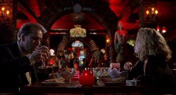 Movie still from “Leaving Las Vegas” (1995), directed by Mike Figgis – People are gathered around a table in a restaurant; Wide shot, Low angle