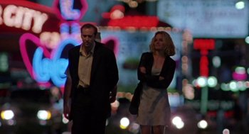 Movie still from “Leaving Las Vegas” (1995), directed by Mike Figgis – A man and a woman are walking in the street; Medium shot, Low angle