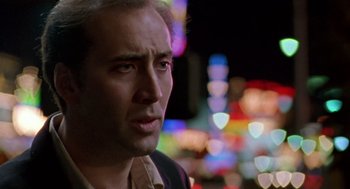 Movie still from “Leaving Las Vegas” (1995), directed by Mike Figgis – A person wearing a jacket; Close Up shot, Over the shoulder angle