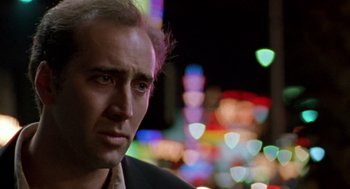 Movie still from “Leaving Las Vegas” (1995), directed by Mike Figgis – A man in a black jacket is looking to his left; Close Up shot, Over the shoulder angle
