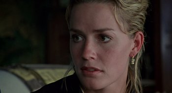 Movie still from “Leaving Las Vegas” (1995), directed by Mike Figgis – A person sitting on a couch; Close Up shot, Over the shoulder angle