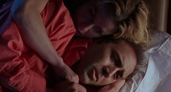 Movie still from “Leaving Las Vegas” (1995), directed by Mike Figgis – A man and a woman laying in a bed; Close Up shot, Overhead angle