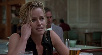 Movie still from “Leaving Las Vegas” (1995), directed by Mike Figgis – A woman sitting at a table with a drink in front of her; Close Up shot, Over the shoulder angle