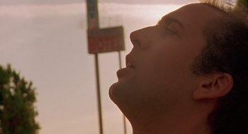 Movie still from “Leaving Las Vegas” (1995), directed by Mike Figgis – A person with his eyes closed; Close Up shot, Low angle