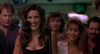 Movie still from “Leaving Las Vegas” (1995), directed by Mike Figgis – A group of women standing next to each other in a room; Close Up shot, Over the shoulder angle