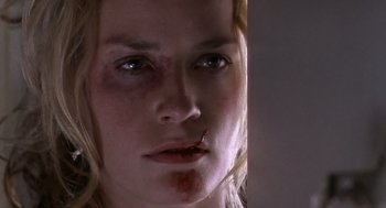 Movie still from “Leaving Las Vegas” (1995), directed by Mike Figgis – A person's face with blood on her face; Close Up shot, Over the shoulder angle