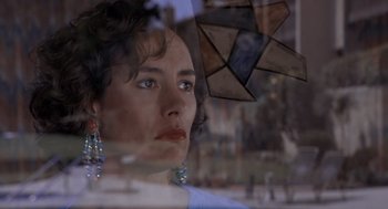 Movie still from “Leaving Las Vegas” (1995), directed by Mike Figgis – A person looking out of a window; Close Up shot, Low angle