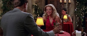 Movie still from “Legally Blonde” (2001), directed by Robert Luketic – A man and a woman sitting at a dinner table; Medium shot, Over the shoulder angle