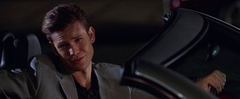 Movie still from “Legally Blonde” (2001), directed by Robert Luketic – A person wearing a suit and tie; Close Up shot, Over the shoulder angle